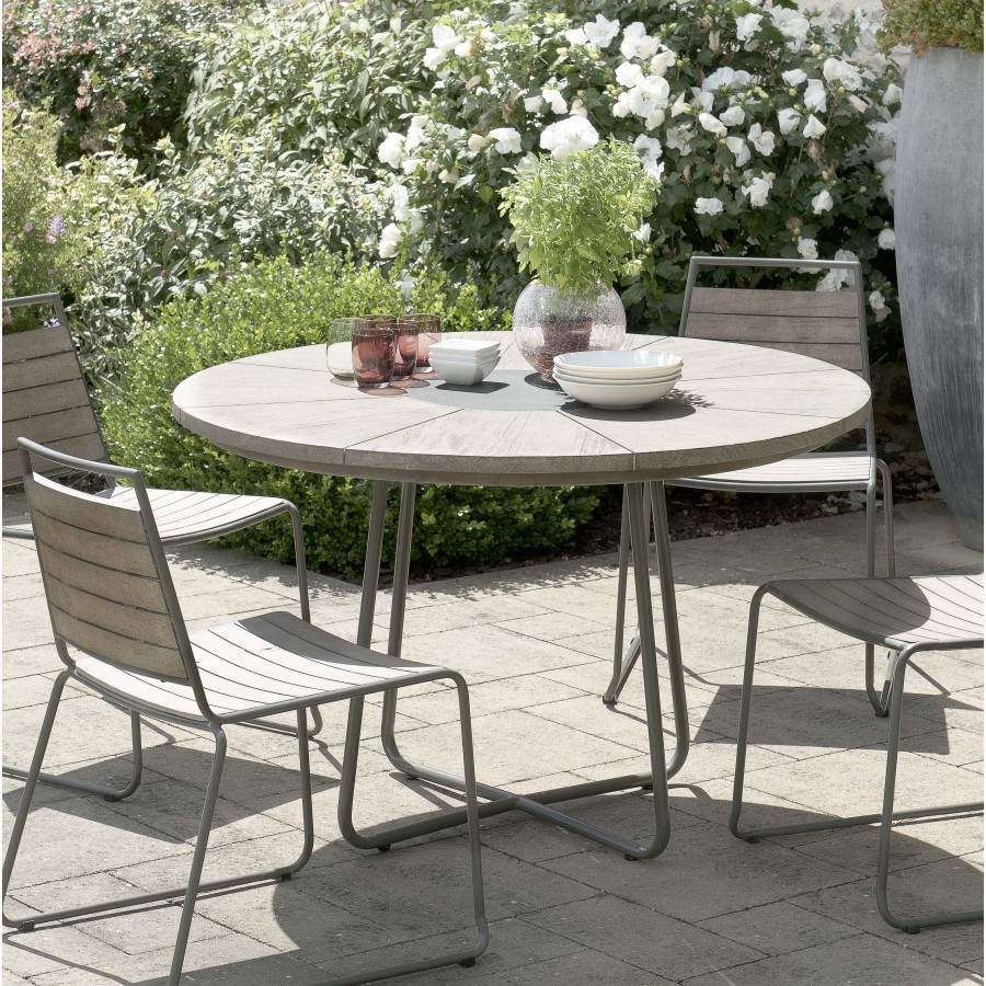 Table de jardin 6-6 pers - ronde bois en teck teinté grisé pieds en métal Table de jardin 6-6 pers - ronde bois en teck teinté grisé pieds en métal